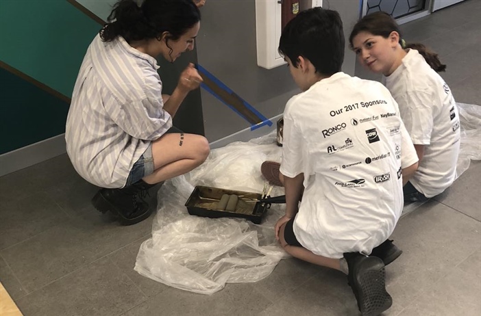 7th Grade NDA Students help paint mural